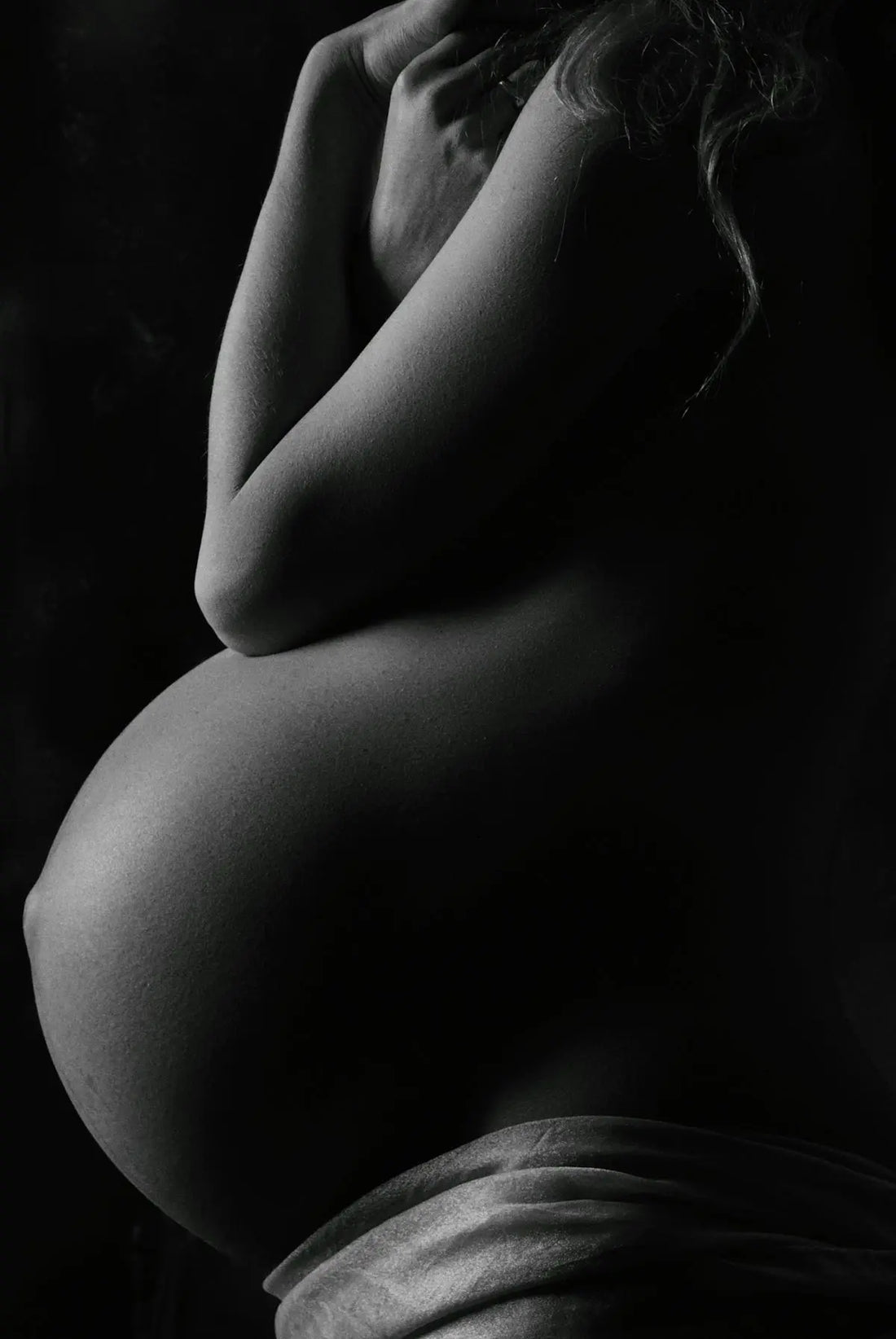 garyscale photography of pregnant woman